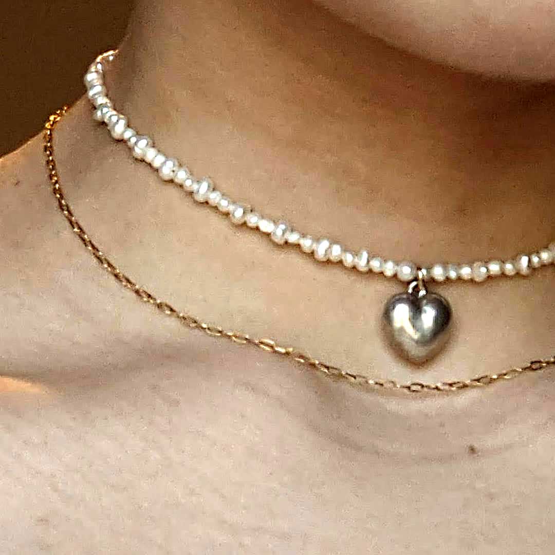 Neck with heart necklace