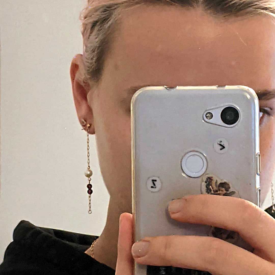 Selfie showing camera and earring
